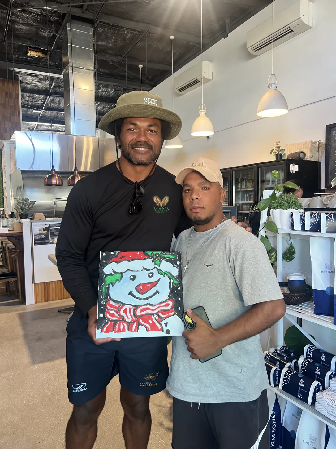 A team member from The Mana Lifestyle sharing a proud community moment with a participant